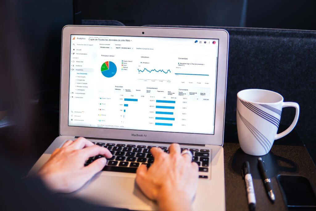 Person analyzing data and optimizing strategies on analytics dashboard - DAW Media.